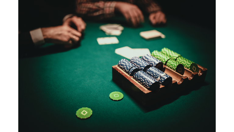 Table with playing cards and chips in casino