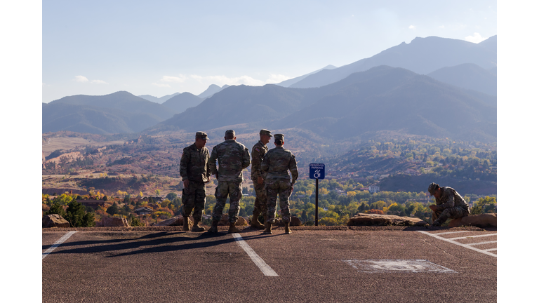 Military group enjoys the beautiful view at the mountains area in Colorado Springs observation point