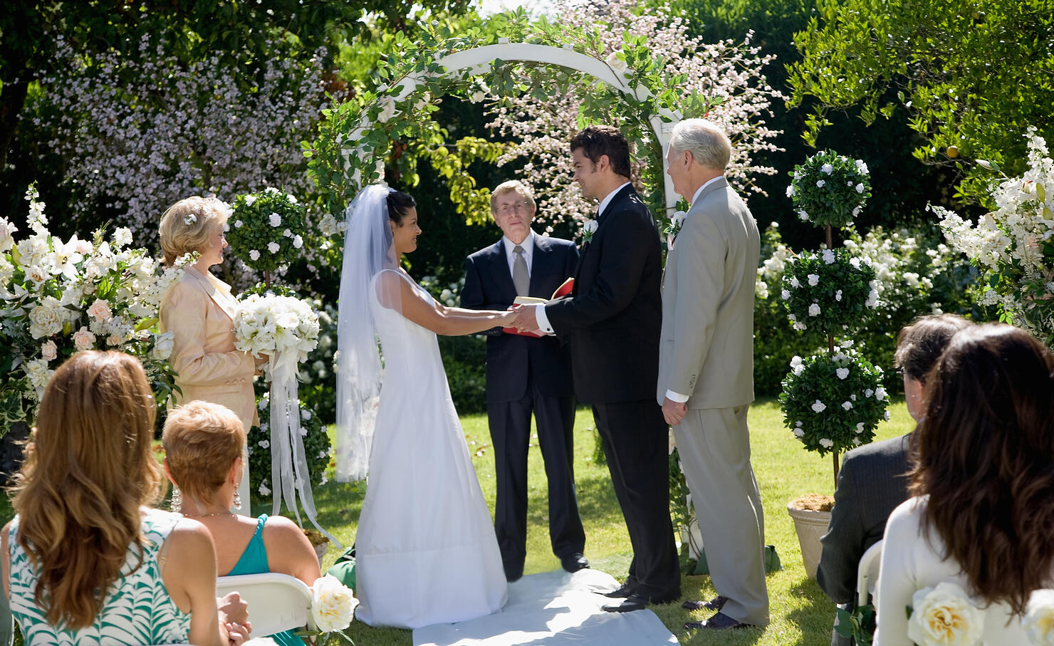 Bride and groom saying vows at wedding