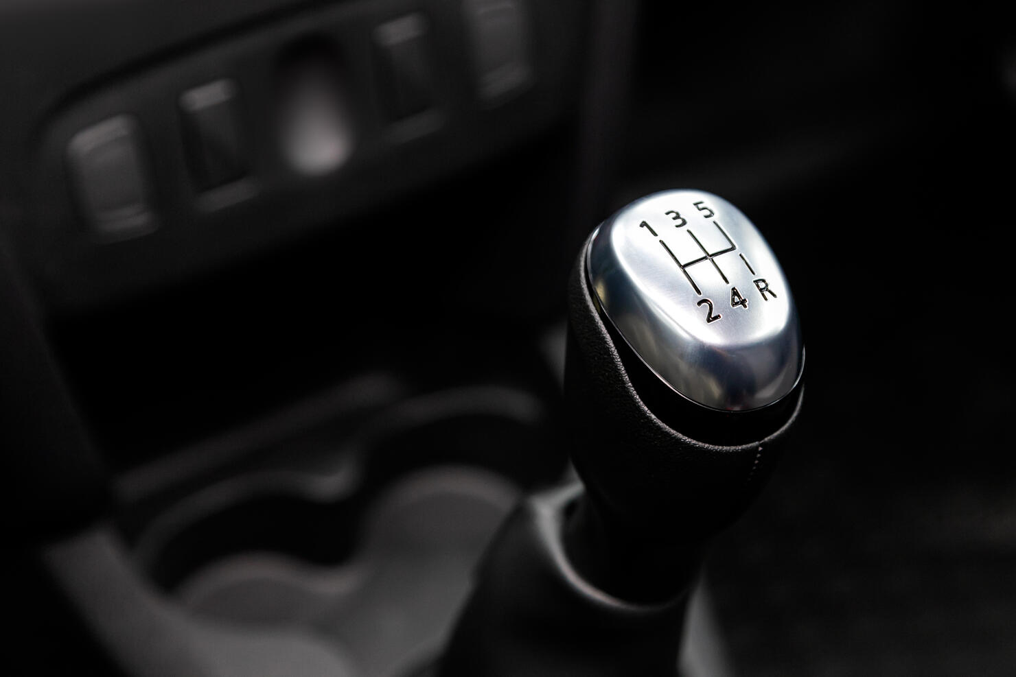 Close-Up Of Human Hand In Car