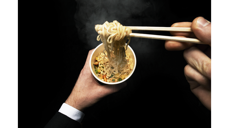 Man Eating Noodles