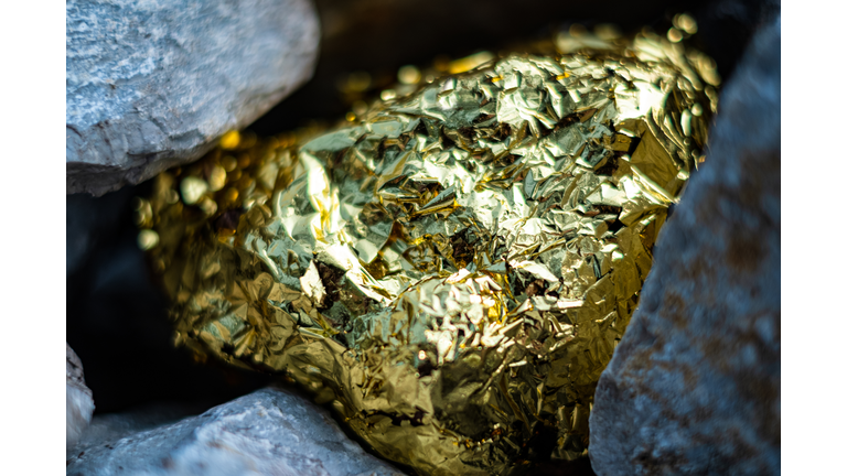 Gold Nugget And Grey Granite Stone Background