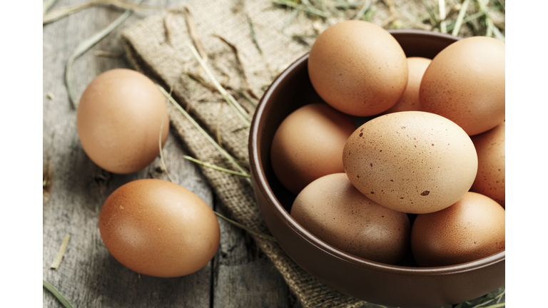 Brown eggs in a plate.