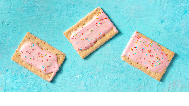 Pop tarts flat lay panorama on a blue background