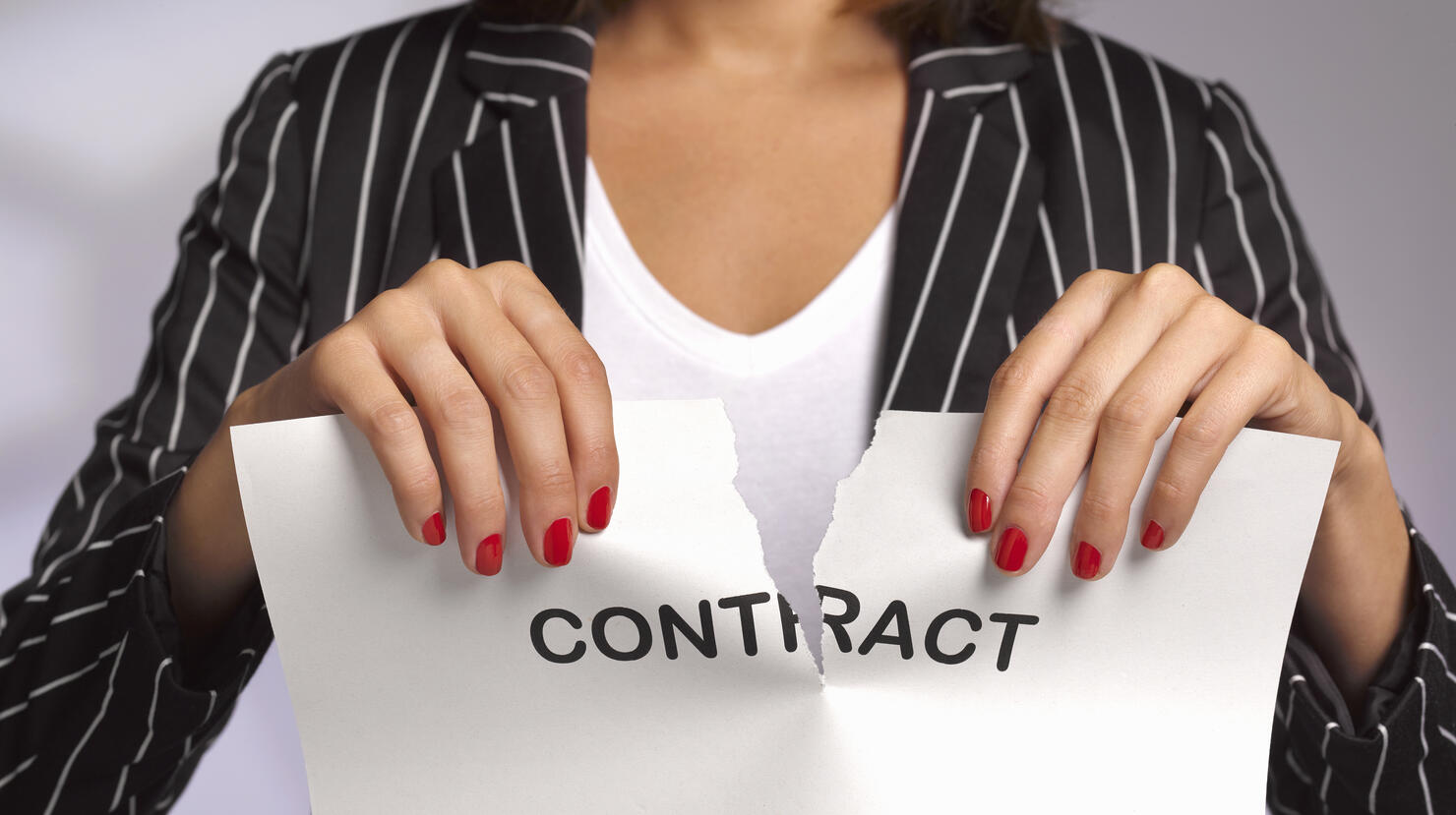 Woman ripping up work contract