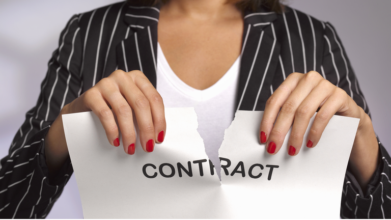 Woman ripping up work contract