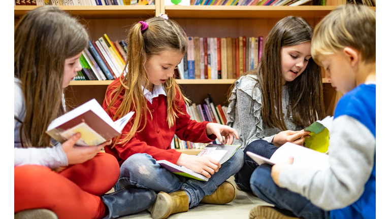Schoolchildren reading a books