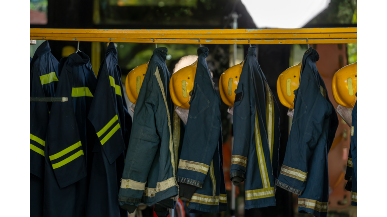 Firefighter protection clothes hanging in the fire station.