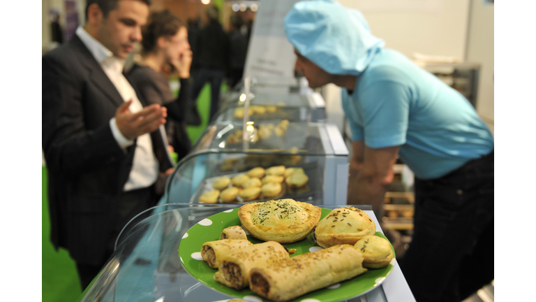 A man looks at pies after New Zealande's