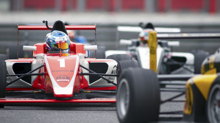 Man driving racing car