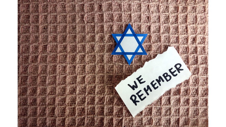 Star of David with text we remember, Holocaust memory day
