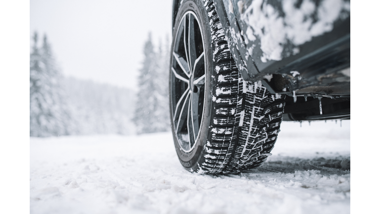 Close Up Of Car Tyre On Snowy Road