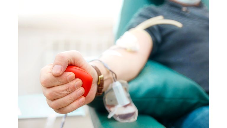 Midsection Of Man Donating Blood