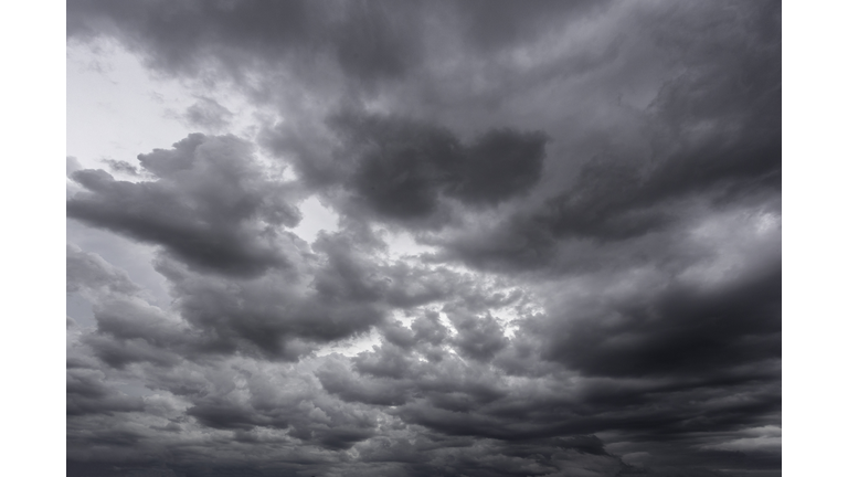 Full frame of a low angle shot of a gray sky with clouds of rain.