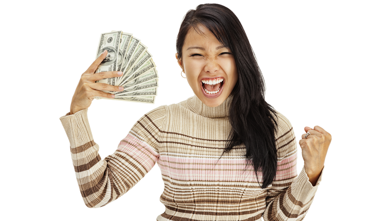 Excited Young Woman Holding Money