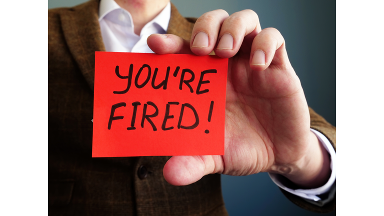 Employer shows phrase You are fired. Wrongful Dismissal concept.