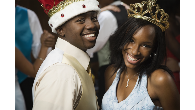 African prom king and queen dancing