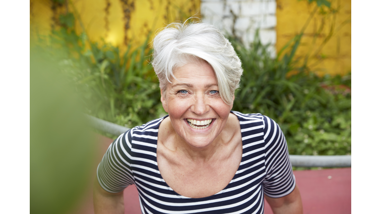 Portrait of happy woman in the garden