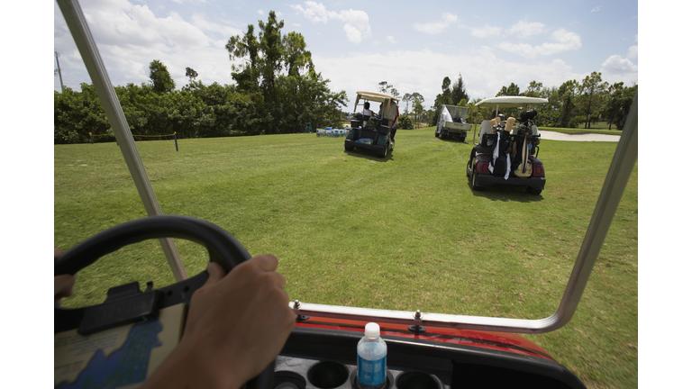 Golf carts driving on golf course