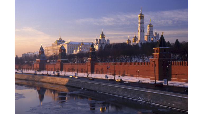 Russia, Moscow, Church of Archangel Michael and Assumption Cathedral behind Kremlin Wall at sunrise