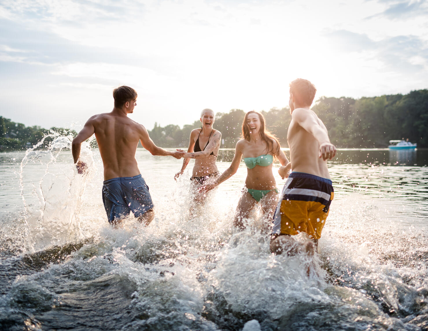 Young Couples Running In Lake