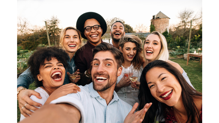 Friends making a selfie together at party