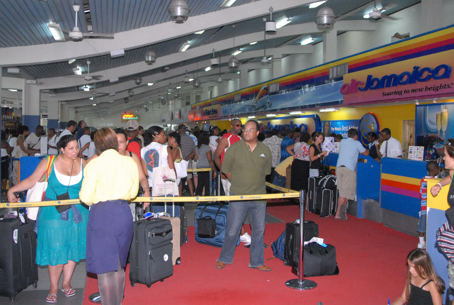 Travelers crowd Sangster International a