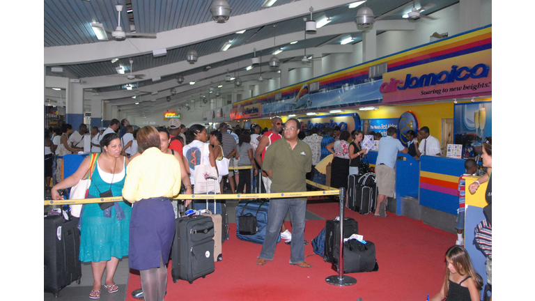 Travelers crowd Sangster International a