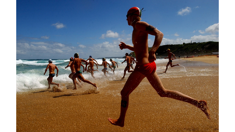 Competitors enter the water for the start
