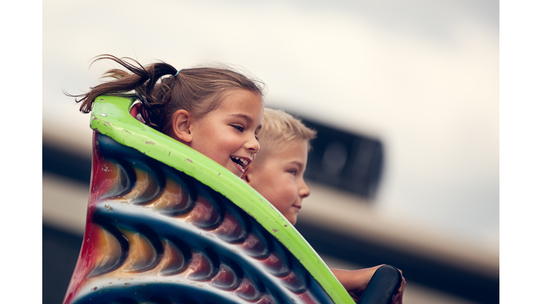 Children on roller coaster