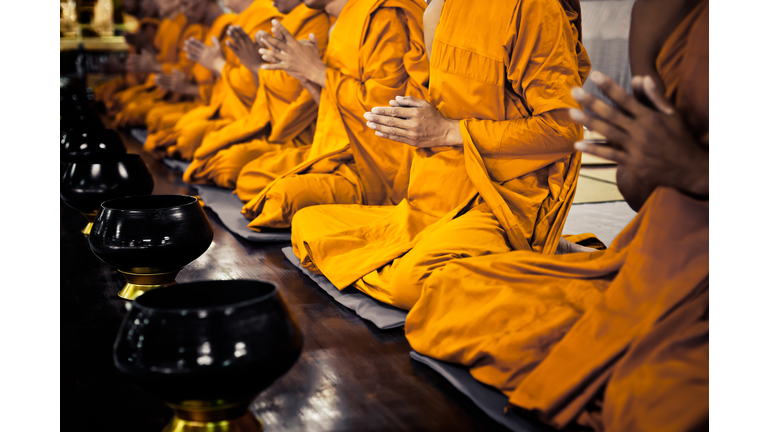 Buddhist monks praying
