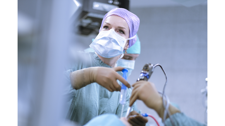 Neurosurgeon in scrubs during an operation