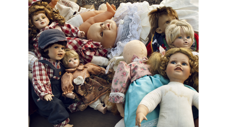 A large group of old vintage dolls in a flea market in Berlin, Germany