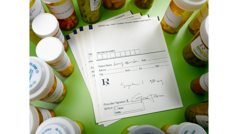 Prescription slip and pill bottles