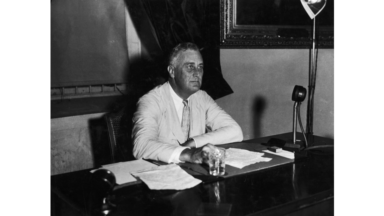 Franklin D. Roosevelt sitting behind desk (B&W)