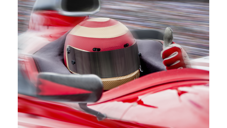 INDY race car driver with thumbs up.