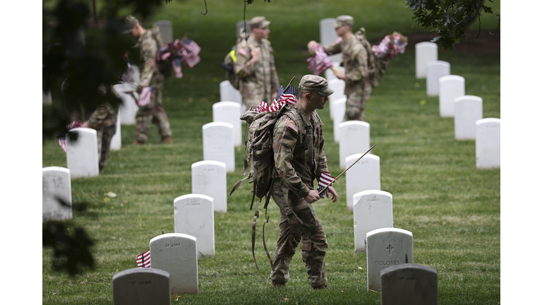 Annual Flags-In Event Held At Arlington Cemetery Ahead Of Memorial Day
