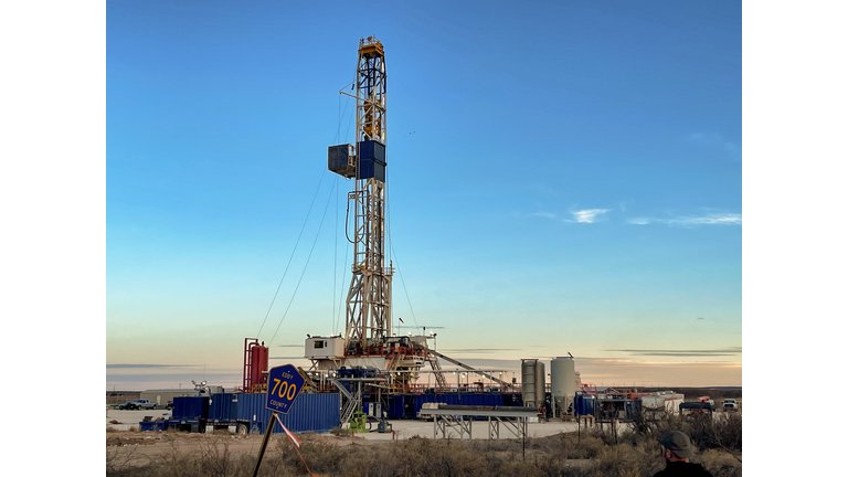 Oil Or Gas Drill Fracking Rig Pad As The Sun Sets In The Background,  New Mexico