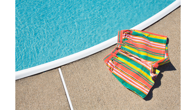 80s Style, 90s Style Striped Shorts Next To Swimming Pool, Summer Background