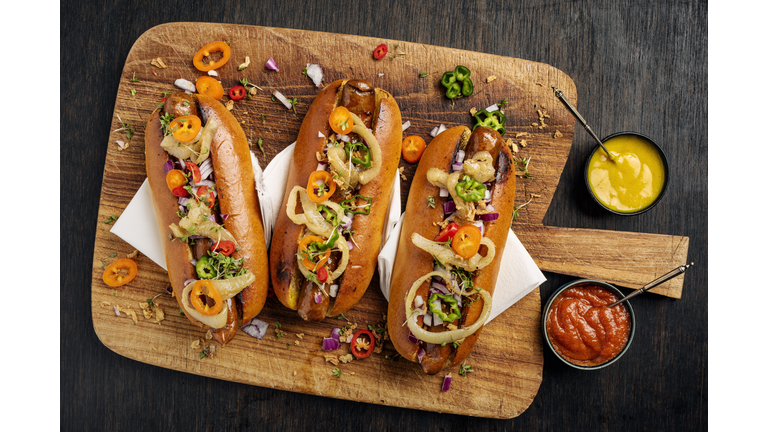 Artisan Hot Dogs in Brioche Rolls with pickles, onion and relishes.
