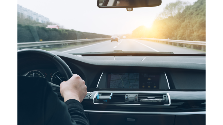 man driving car from rear view