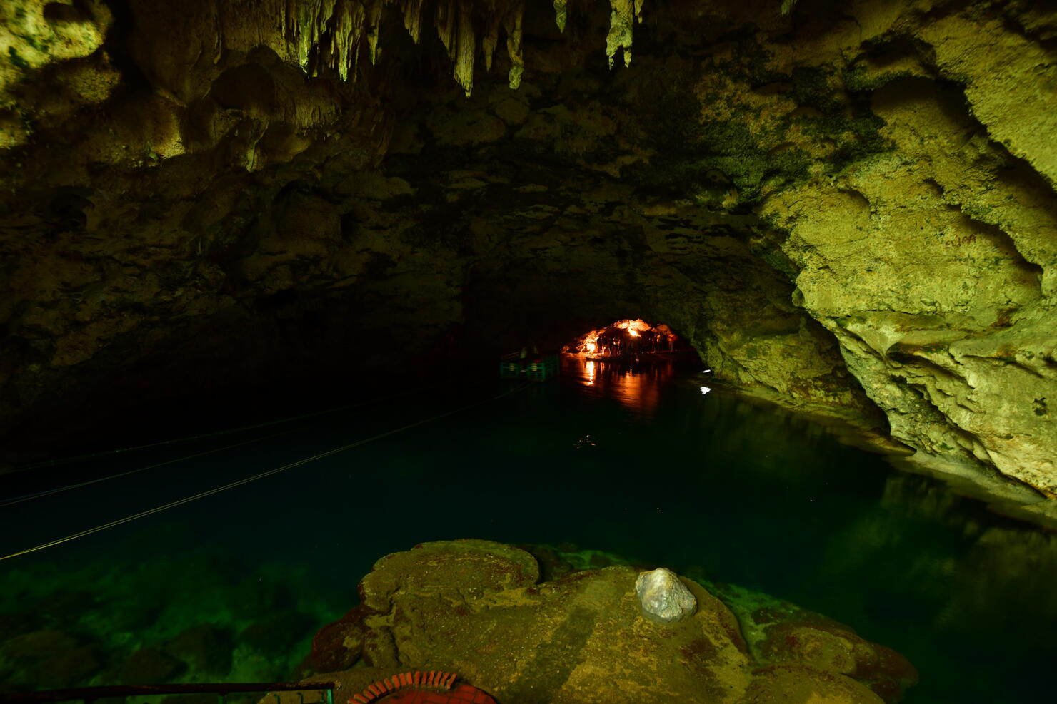The ferry in the cave leading to a hidden karst lake