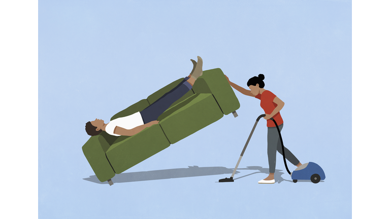 Wife vacuuming, lifting sofa with sleeping husband