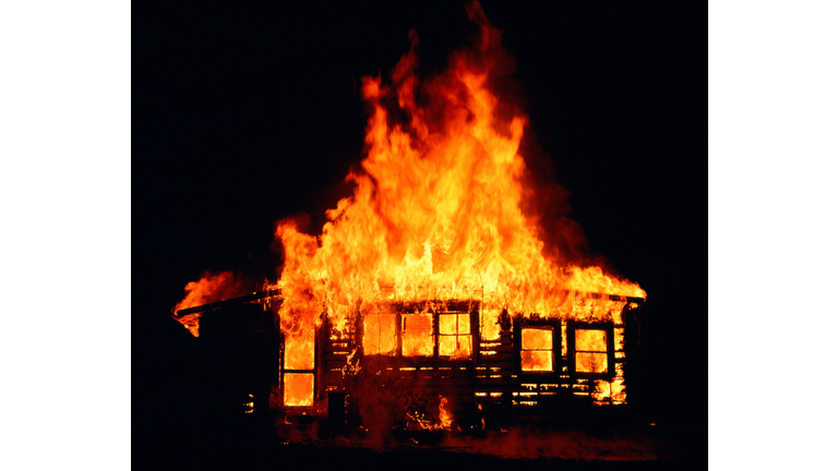 House on fire at night