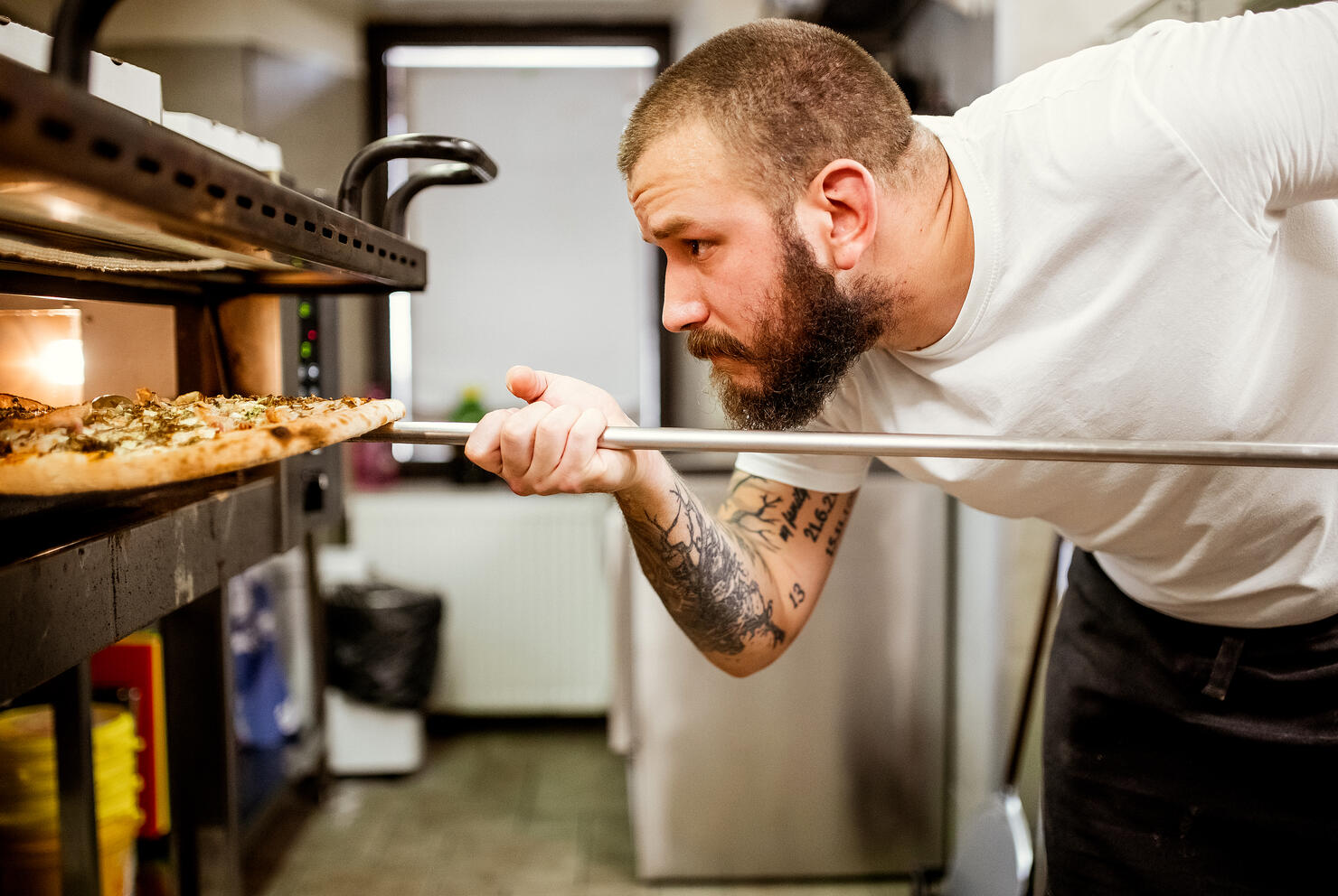 Pizza chef working in the kitchen