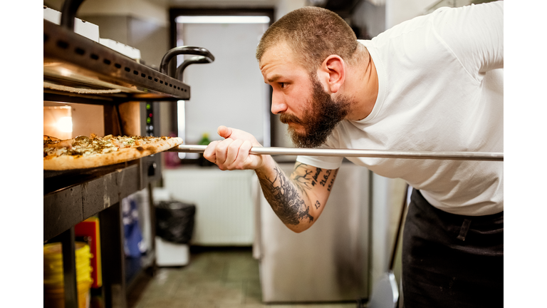 Pizza chef working in the kitchen