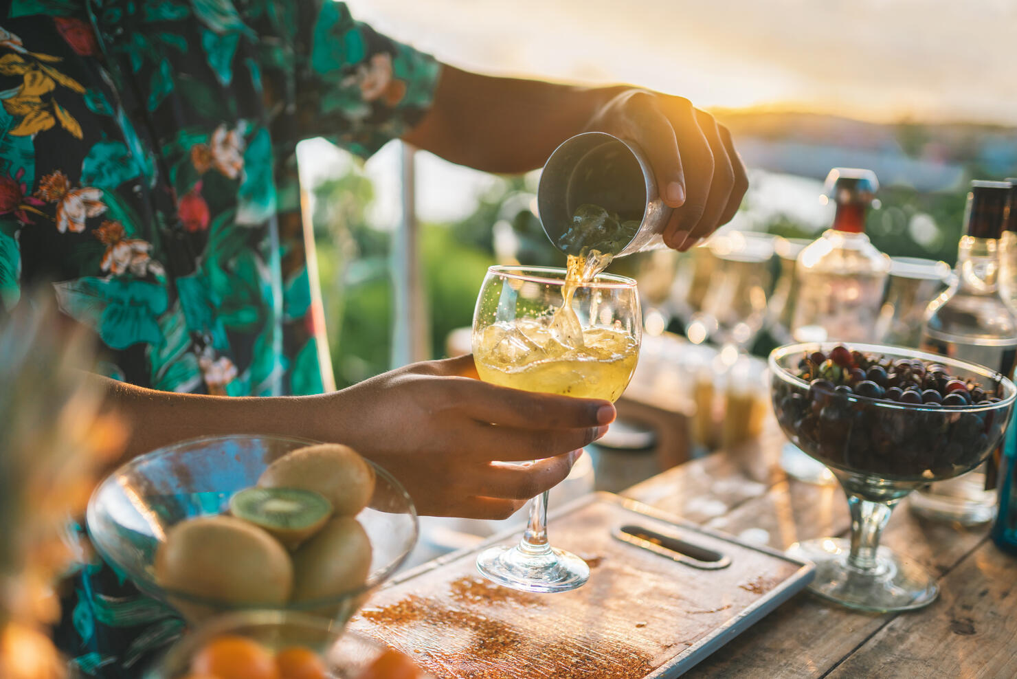 Bartender serving a fruit cocktail