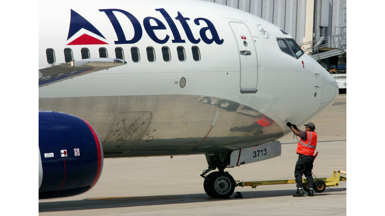 A Delta Airlines ground crew employee fi