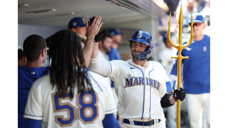 Seattle Mariners Vs. New York Mets Seattle Mariners Teoscar Hernandez 35 is  handed the trident after