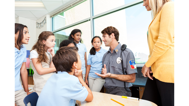 Interested private school students listen to police officer